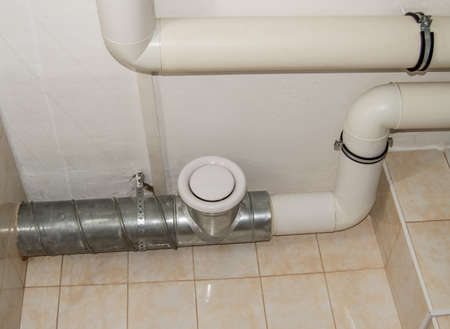 Modern indoor water supply and Sewerage system, pipes made of plastic, polypropylene. Close up.