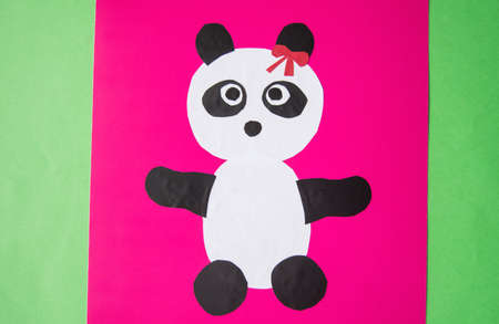 Step 7. Cute Panda with a bow. The concept of DIY and children's creativity. Step-by-step instructions: the paper Panda app. Creative activities with the child during the quarantine. The endの写真素材