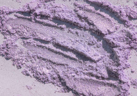 Brilliant lilac eye shadow on a grey background.の写真素材