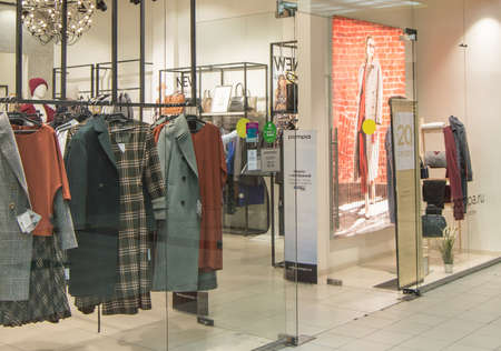 Europolis, Moscow, Russia - October 8, 2019: interior of fashion boutiques with modern clothingのeditorial素材