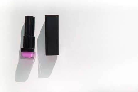 Smears of lilac nail polish on a white background, beauty concept, vertical photography.