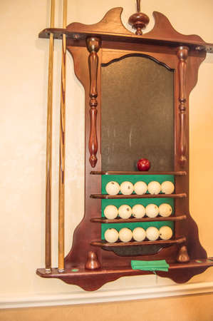 Shelf on the wall for balls and billiard cue, vertical shot