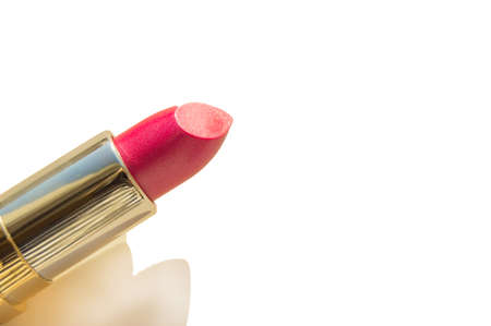 A smear of lipstick in bright pink on a white background.の写真素材
