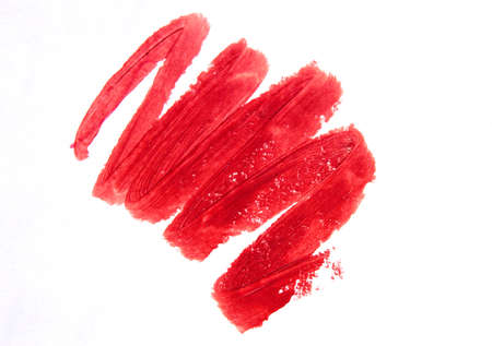 A smear of lipstick in bright pink on a white background.