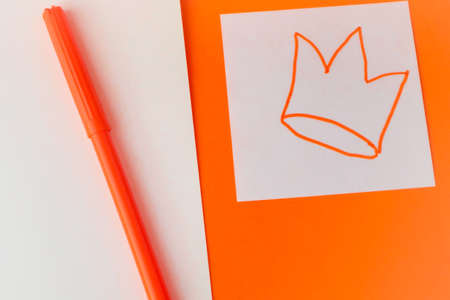 A template in the traditional colors of the King's Day celebration in the Netherlands. Orange background and a white paper square with the hashtag Koningsdag. copyspace.の写真素材