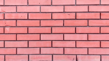4k video, Close-up of the facade of a modern yellow brick building with a brown stone foundation.