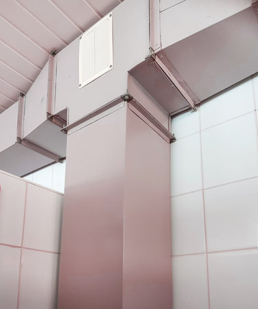 Industrial ventilation, air duct with metal box, indoors, vertical.の写真素材