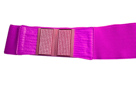 Lilac fashionable women's knitted elastic band belt with metal buckle with rhinestones, isolated on a white background.の写真素材