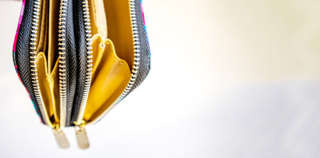 Fashionable outdoor women's empty purse, on a white background, copy space to the right.の写真素材