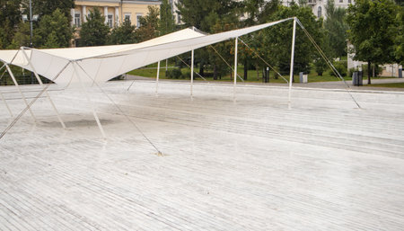 White wood new decking and tarpaulin awning, empty lot in a recreation park.の写真素材