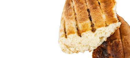 Bits of delicious toasted flatbread, isolated on white background, space for text on the left, top...