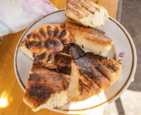 Bits of delicious toasted flatbread on a plate, top view, Asian oriental cuisineの写真素材