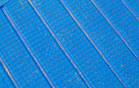 Industrial safety flooring pool or gym walkway blue rubber surface with diagonal channels protection from slipping and moisture horizontalの写真素材