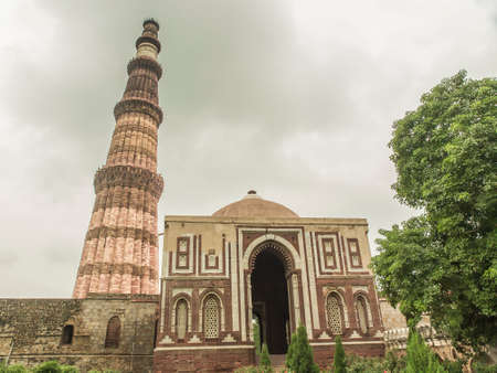 Qutub Minar, famous minaret in India with an adjacent mosqueの写真素材