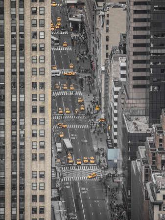 aerial view of a New York street with the typical yellow taxi
