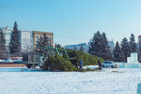 Ulan-Ude, Russia, 12.04.2019: Festive arrangement of the main city square on New Year. Workers install a Christmas tree.のeditorial素材