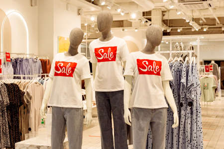 Faceless mannequins in casual clothes in fashion shop clothing store, black friday sale shopping...