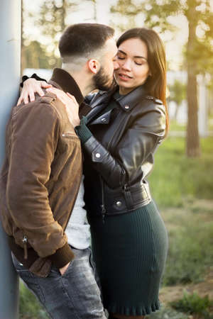 Beautiful couple in love on romantic dating, sensual relationship and desire of lovers, young man and woman having fun together outdoors, happy family life and candid lifestyle, vertical imageの写真素材