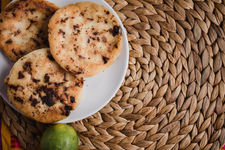 Gordita de chicharron presado is a traditional food from Mexico, that it is usually stuffed with vegetables, cheese, meat and spicy sauceの写真素材