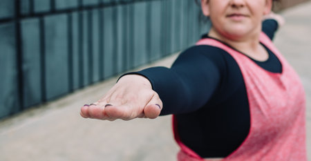 Body positivity: oversize woman doing yogaの写真素材