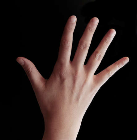 Open hand on black backgroundの写真素材