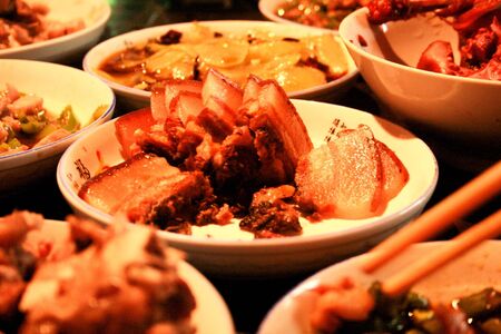 Chinese delicious meal served with smoked pork vegetables and others dishesの素材