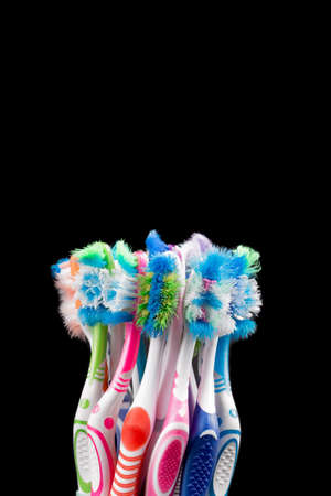 Used toothbrush isolated on black background. Plastic health care conceptの写真素材