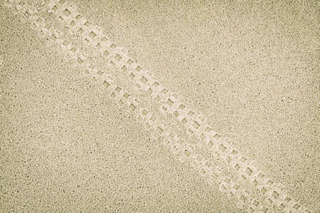 Bicycle tracks in the sand. Natural background patternの写真素材