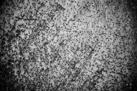Rusty metal surface abstract, old metal black white sheet with ants on it texture, flat obsolete wall background in horizontalの写真素材