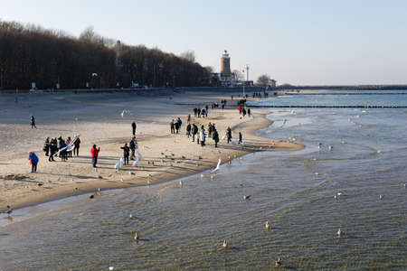 People winter walking at Baltic Sea in Kolobrzegのeditorial素材