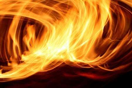 Long exposure shot of fire forming circlesの写真素材