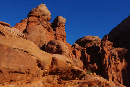 Red rock formations and intense blue sky near Fisher Towers, Utahの写真素材