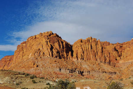 Red rock walls under blue and white sky, Utahの写真素材