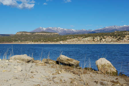 Blue Recapture Reservoir and Manti La Sal Mountains, Utahの写真素材