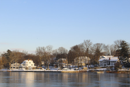 houses on frozen over lakeの写真素材