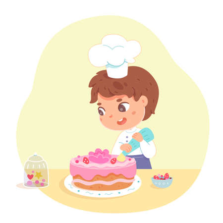 Boy making cake at home. Little kid in hat and apron decorating cake with pink icing and cream...