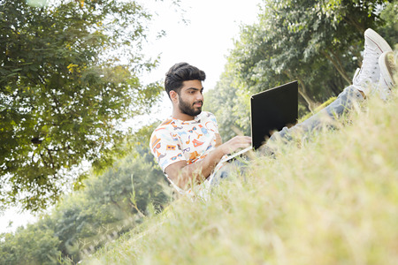 college boy work on laptop
