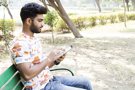 college boy in a parkの写真素材