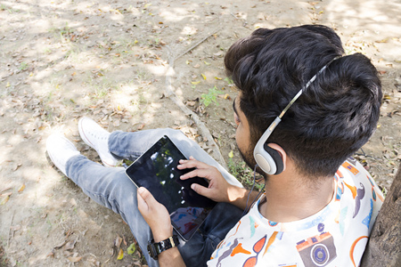 college boy enjoying a music