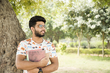 college boy in a parkの写真素材
