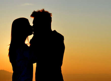 Shadows kissing at sunset  の写真素材