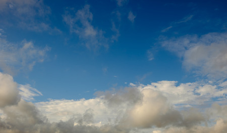Clouds on lower third with mostly blue sky above.