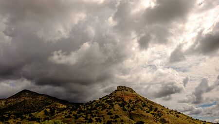 Mountains in southern New Mexico, USA. The right mountain has a cross on top.の写真素材