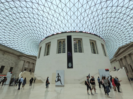 London, UK - 09.25.2021: Visitors walking in the Great Court of the British Museum under the curved...