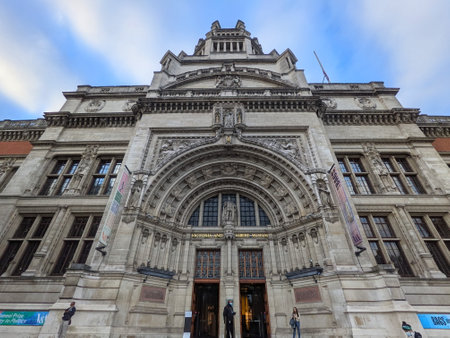London, UK - 10.15.2021: Low-angle view of the facade of the Cromwell Road Entrance of the Victoria and Albert Museum under a blue sky with tourists standing in the frontのeditorial素材
