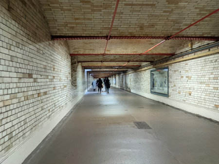 London, UK - 11.06.2021: People walking in the connecting tiled tunnel of South Kensington Underground Station to the nearby museumsのeditorial素材