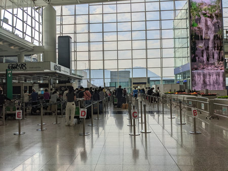 Hong Kong International Airport - 09.06.2022: Newly arrived passengers waiting at the arrival hall...