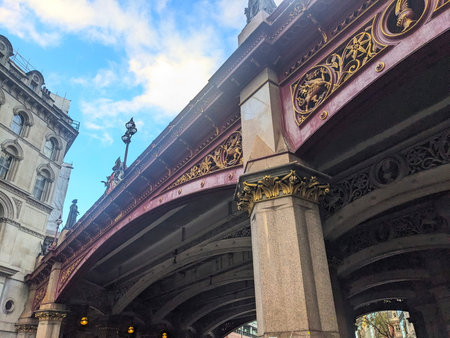 Detailed low angle view of the historic Holborn Viaducts Victorian ironwork against a blue skyのeditorial素材