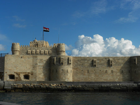 Lateral view of Alexandria lighthouse with cloudy blue sky in Egyptのeditorial素材