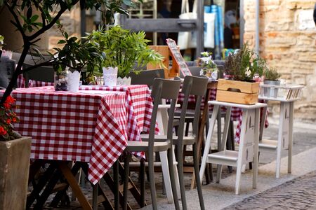 Romantic rustic and cosy italian restaurant, Trattoria Osteria in Italy.の写真素材